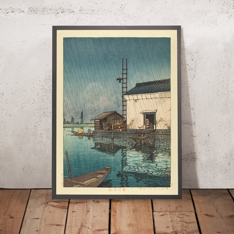 A framed image of Ushibori in the Rain by Hasui Kawase, 1935