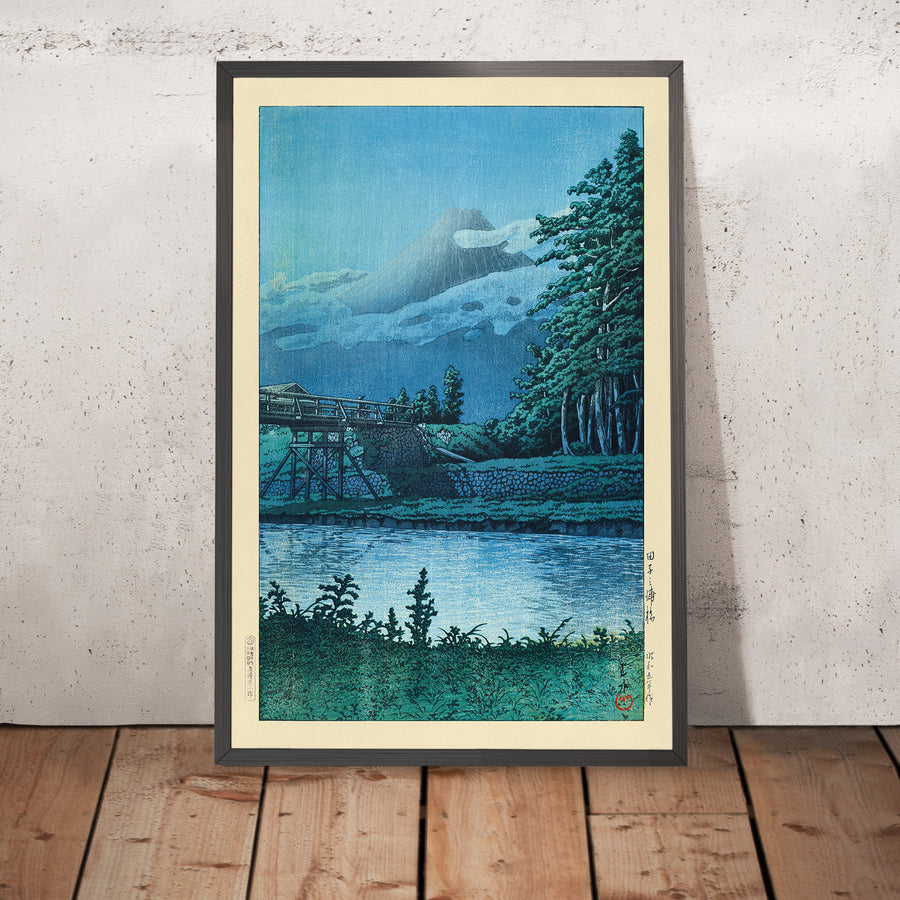 A framed image of Tagonoura Bridge and Mt. Fuji by Hasui Kawase, 1935